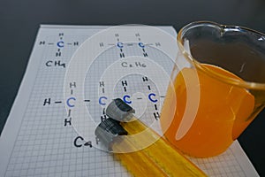 Chemical solution in laboratory tubes on a notepad - chemistry concept