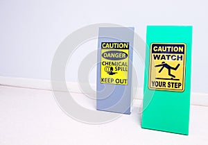 The Chemical Spill kit tag stand and warning danger caution hazard tag sign watch your step for emergency response situation.