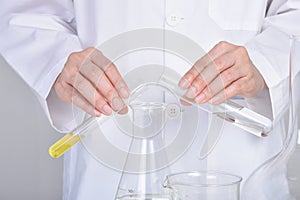 Chemical substance pouring and mixing, Laboratory and science experiments, Oil formulating the chemical