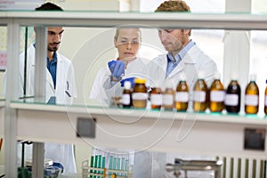 Chemical technicians perform experiment in lab