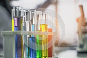 Chemical tube, put on table, With colorful fluids, In glass tubes for cosmetics from notebooks, in the laboratory, the concept