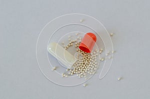 Chemicals inside tiny capsules of the drug.