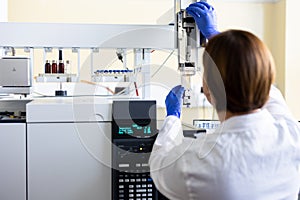 Chemist is analyzing sample in laboratory