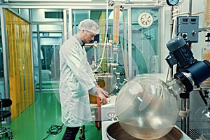 Apothecary extract using cannabis extraction machine in laboratory.