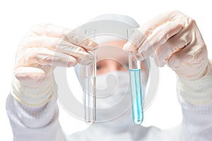 Chemist, biologist, holding in front of two test tubes with liqu