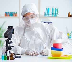 Chemist checking and testing plastic dishes