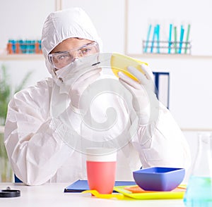 Chemist checking and testing plastic dishes