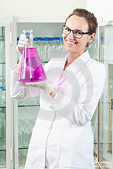 Chemist holding flask