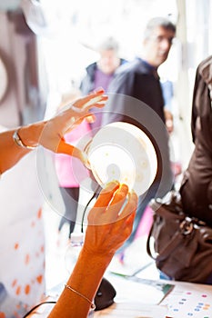 Chemist is holding a patri dish