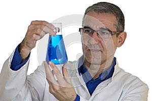 Chemist Holding Up Beaker of Blue Chemical Over White Backgroun