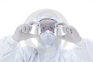 Chemist in laboratory checking test tubes.