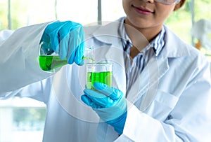 Chemist scientis female doing experiments and researchers working in the laboratory photo