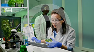 Chemist scientist taking dna solution from test tube with micropipette