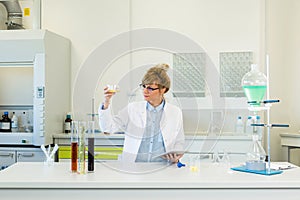 Chemist working with terpene CBD crystals in laboratory