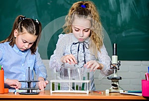 Chemistry equipment. students doing biology experiments with microscope in lab. Chemistry education. curious children