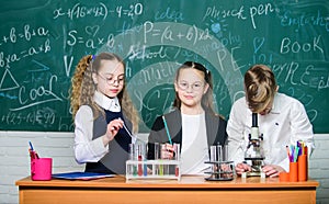 Chemistry equipment. students doing biology experiments with microscope in lab. Little kids learning chemistry in