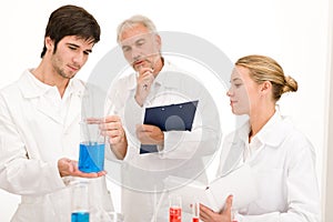 Chemistry experiment - scientists in laboratory