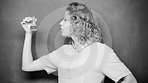 Chemistry lab. Woman teacher performing experiment with bulb and liquid. Interesting and fascinating. Explore chemistry