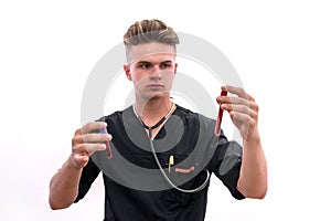 Chemistry and laboratory experiment concept. Man in medical uniform and protective gloves holding red test tube