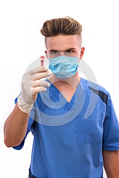 Chemistry and laboratory experiment concept. Man in medical uniform and protective gloves holding red test tube