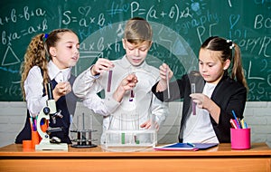 Chemistry microscope. Little kids learning chemistry in school lab. students doing biology experiments with microscope