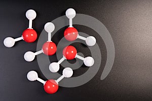 Chemistry model atom of molecule water scientific elements. Integrated particles hydrogen and oxygen atom on black background.