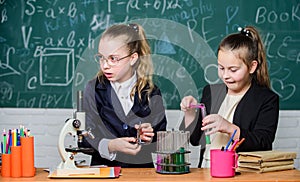 Chemistry research in laboratory. Little girls genius in school lab. Science lab. science experiments in laboratory