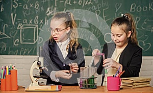 Chemistry research in laboratory. Little girls genius in school lab. Science lab. science experiments in laboratory