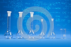 Chemistry science - flasks on blue background