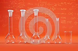 Chemistry science - flasks on orange background