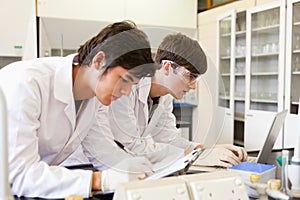 Chemistry students writing a report