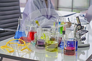 Chemists work lab in the morning,With test pieces working with colorful liquid chemicals, glass tubes