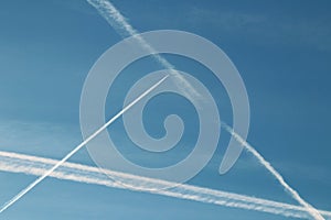 Chemtrails in the blue sky photo