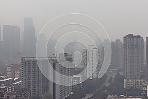 Chengdu, China, residential buildings obsured by the polluted air