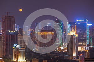 Chengdu downtown skyline at night with full moon