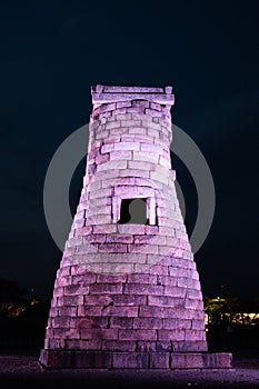 Cheomseongdae observatory by night used for weather prediction and astrology - observe stars and universe. Tower made of stone.