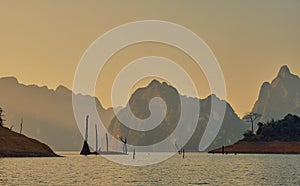 Cheow Lan lake in Khao Sok National Park, Thailand. Tropical landscape at the dawn postcard poster wallpaper