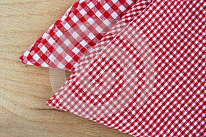Chequered napkins on wooden table