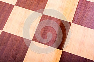 Chequered white and brown chess board on display