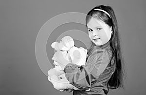 Cherishing memories of childhood. Childhood concept. Small girl smiling face with toys. Happy childhood. Little girl photo