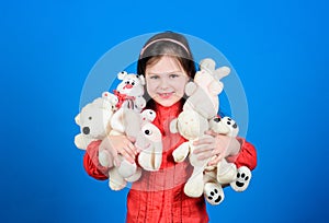 Cherishing memories of childhood. Small girl smiling face with toys. Happy childhood. Little girl play with soft toy