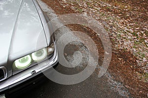 Chernigov, Ukraine - January 6, 2021: Old car BMW 7 Series E38 on the road in the forest. Gloomy weather