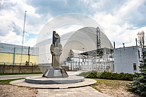 Chernobyl nuclear power plant with shelter and monument in memory of disaster