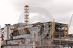 Chernobyl nuclear power plant. View on old destroyed sarcophagus before cover station of new safety confinement. Pripyat