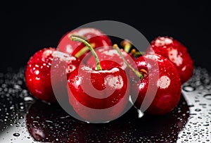 Cherries on black background. Fresh ripe Cherry berries close-up. Heap of Organic red cherries