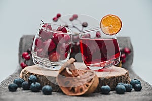Cherries, blueberries and an orange drink
