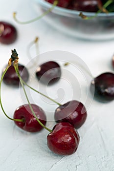 Cherries in a bowl isolated on white. fresh red cherries on a white table.