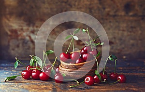 Cherries in a bowl on a wooden table