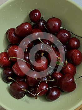 cherries close-up. Harvesting sweet cherries. Red ripe berry with a branch of a cherry tree