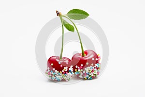 Cherries decorated with colorful candy sprinkles